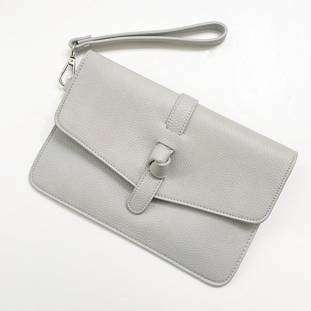 Charming Charlie light gray knot wristlet